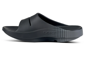 Black sandal with gray sole on a white background