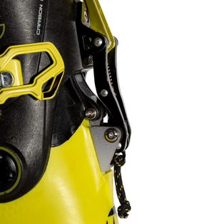 Close-up of a yellow and black ski binding on a white background