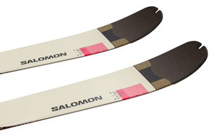 Two Salomon skis lying on a white background