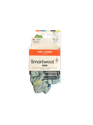 Smartwool socks in packaging on a textured surface