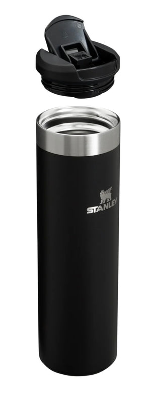 Black Stanley insulated tumbler with silver lid on a white background