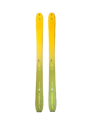 Two yellow skis on a textured gray floor